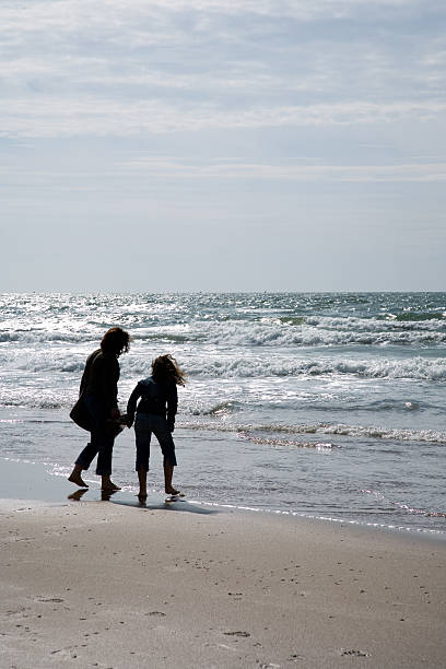 istock Silhouettes by the sea 116044299