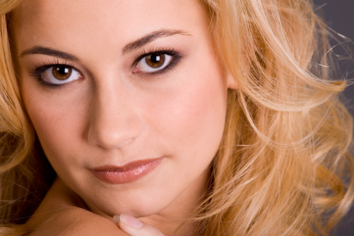 Portrait of a beautiful young woman with blond hair