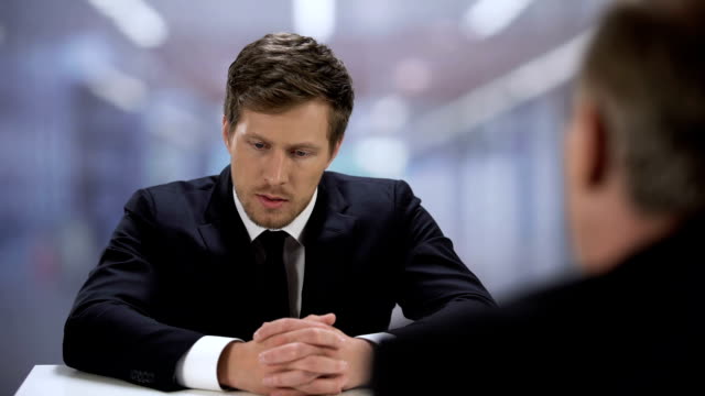 Company HR manager watching through young man resume, job interview failure