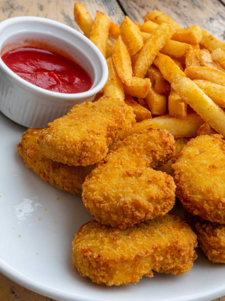istock Fried chicken wings on wooden table. Breaded Crispy fried kentucky chicken tasty dinner with tomato sauce 1160445002