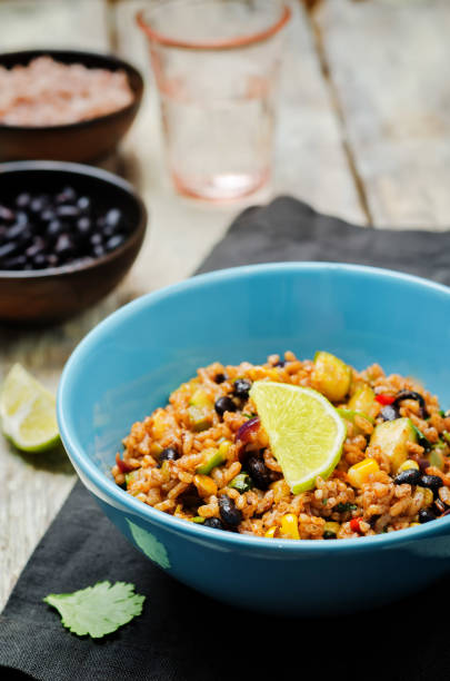 istock Black beans pepper cilantro zucchini  lime brown rice 1160445311