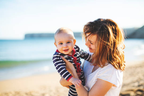 istock Mother with her little son at the beach 1160446014