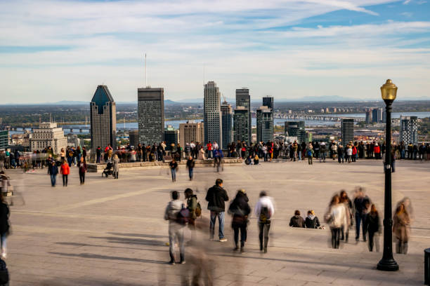 People looking at Montreal cityscape in autumn.