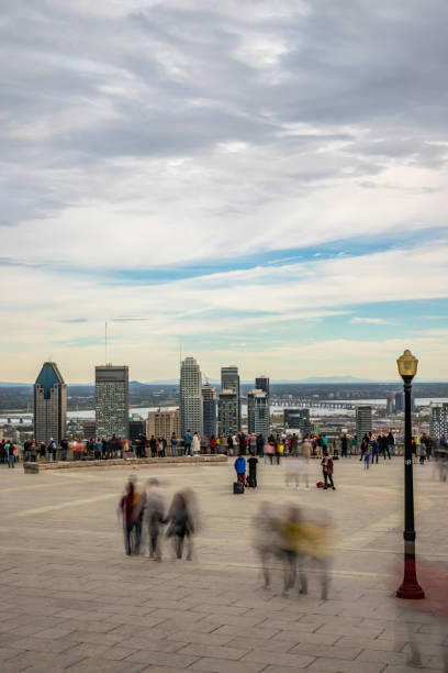 istock People looking at Montreal cityscape in autumn. 1160450383