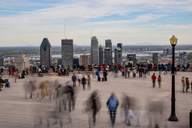 People looking at Montreal cityscape in autumn.