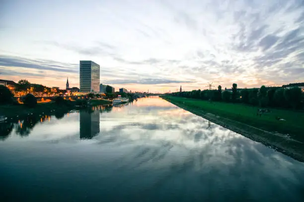 scenic sunset over a river in a city in germany