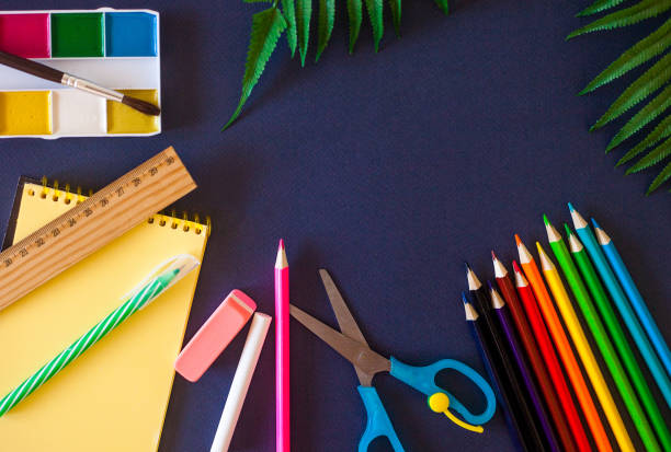 istock School supplies on dark blue background. Back to school concept 1160451469