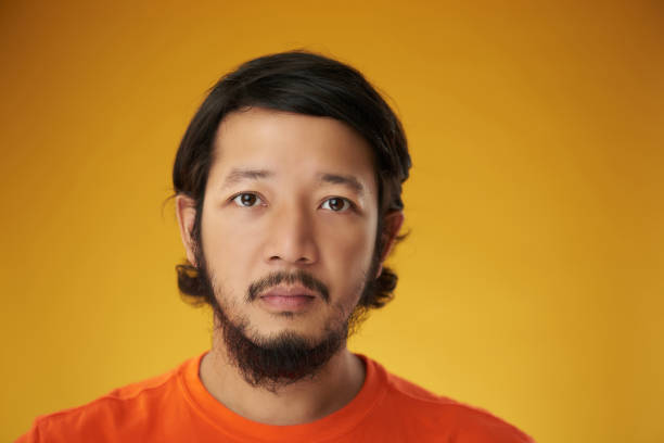 istock Asian guy headshot color background 1160453364