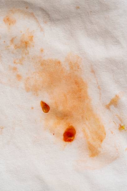 istock Stain of tomato on white cloth 1160464723