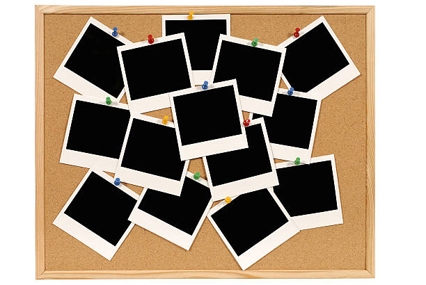 Bulletin board with blank photo prints Cork bulletin or notice board with numerous blank instant print pictures.  To see my complete collection of Polaroids please CLICK HERE.  Alternative version of this file shown below: bulletin board photos stock pictures, royalty-free photos & images
