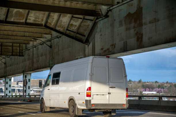 istock Commercial cargo mini van running on the two level bridge 1160472034
