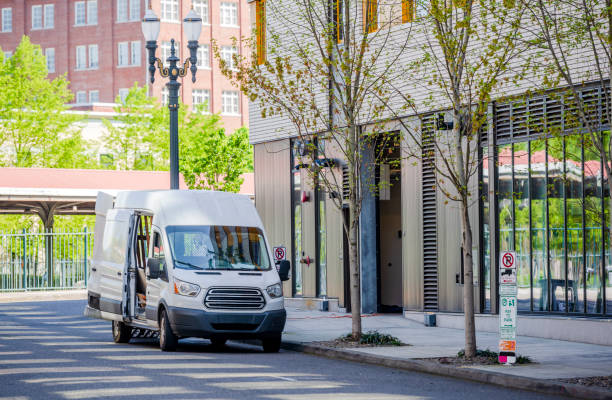 istock Compact cargo mini van loading cargo from multilevels building in the city down town 1160472566