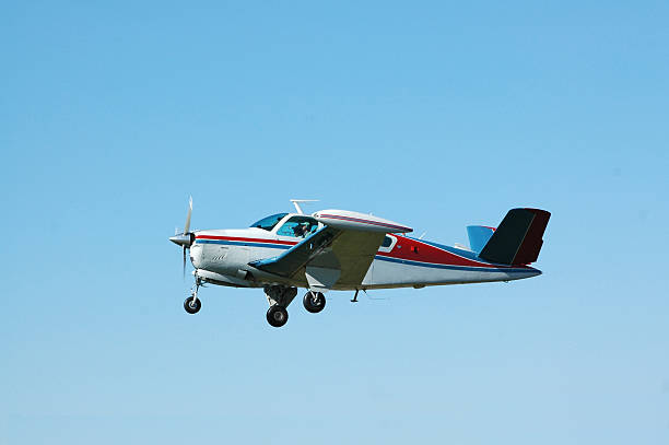 istock private airplane Beech Bonanza flying in blue sky 116047299