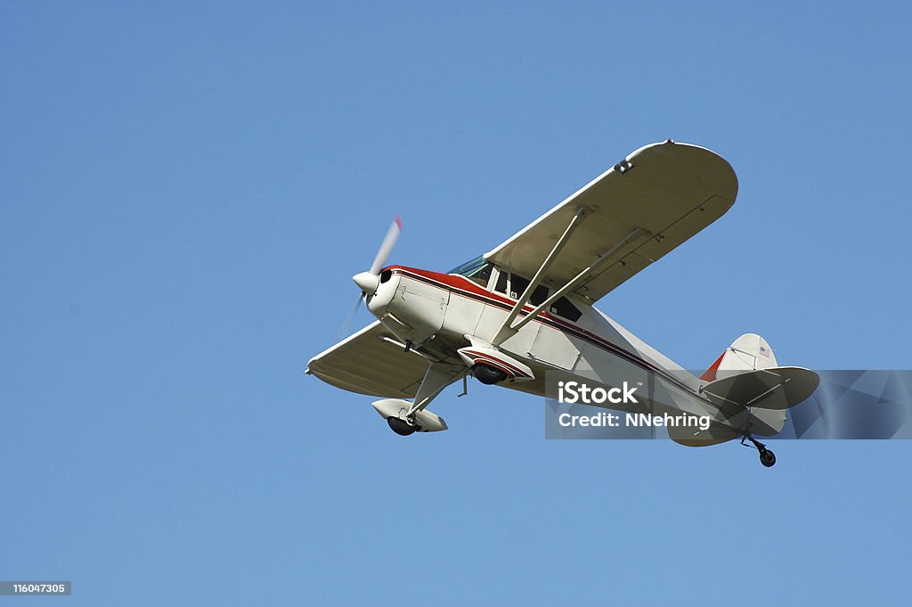 private airplane Fairchild M62A flying in clear blue sky Small private airplane against blue sky. Built in the 1940s. Fairchild M-62A. Propeller Airplane Stock Photo