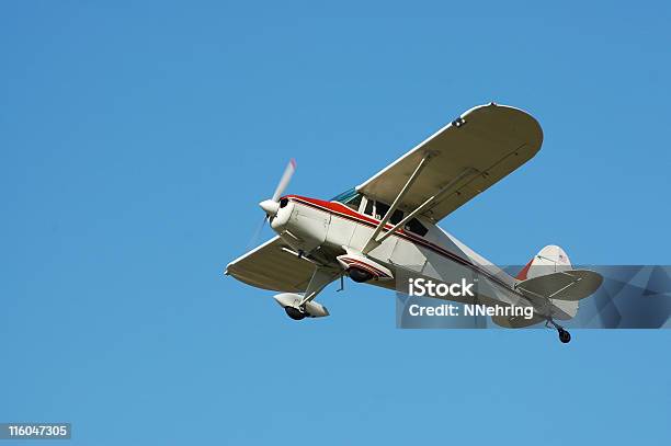 Private Airplane Fairchild M62a Flying In Clear Blue Sky Stock Photo - Download Image Now
