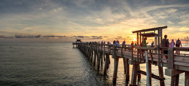 istock Sunset at the Naples Pier on Naples Beach 1160478072