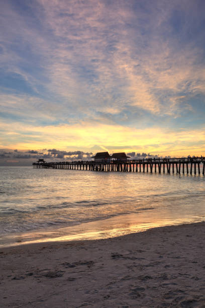 istock Sunset at the Naples Pier on Naples Beach 1160478111