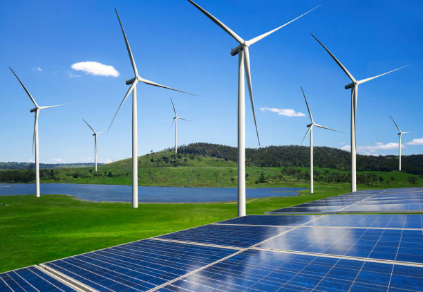 istock Solar panel and wind turbine farm clean energy. 1160478141