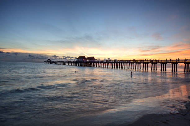 istock Sunset at the Naples Pier on Naples Beach 1160478189
