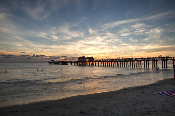 istock Sunset at the Naples Pier on Naples Beach 1160478473