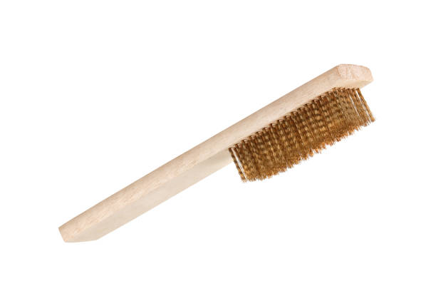 istock Close-up Brass brush with wooden handle isolated on white 1160500406
