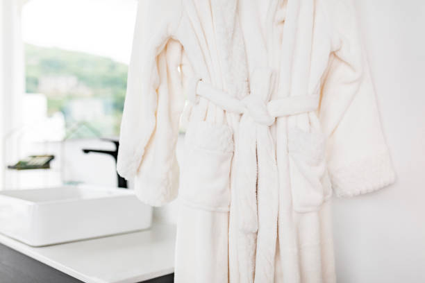 White bathrobe bathrobe Bathrobe on hanger terry towel stock pictures, royalty-free photos & images