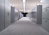 Long hall with grey file cabinets on both sides