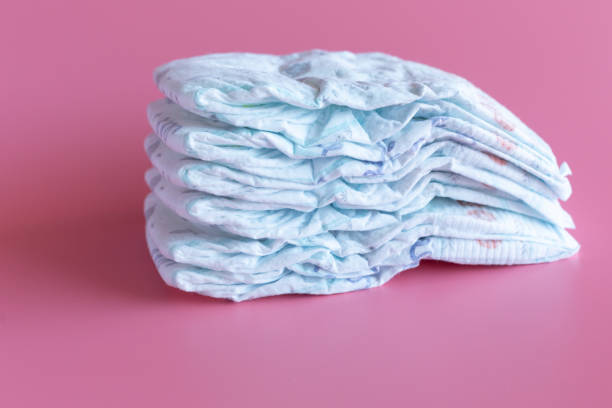 istock Some baby diapers on a Pink Background 1160503482