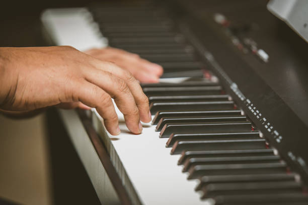 istock Selective focus of Man hand playing piano 1160506600