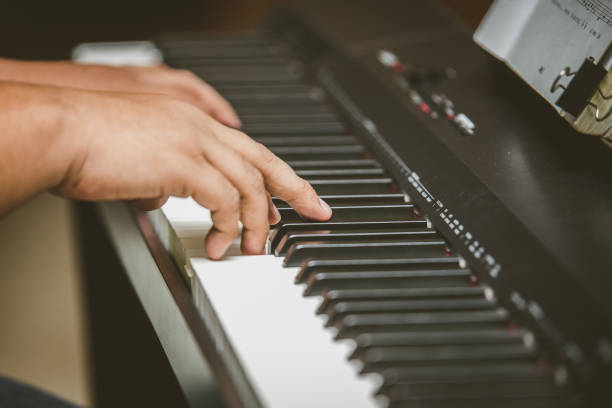 istock Selective focus of Man hand playing piano 1160506608