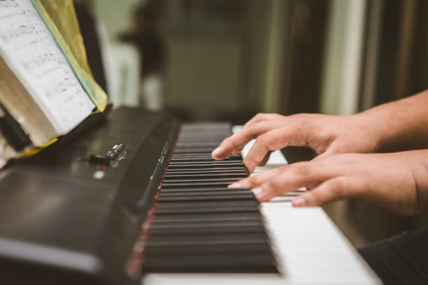 istock Selective focus of Man hand playing piano 1160506609