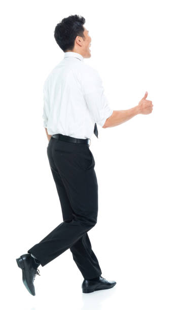 istock Handsome Asian Businessman - rear view walking and doing thumbs up 1160509015