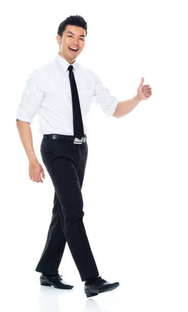 istock Handsome Asian Businessman - side view walking and doing thumbs up 1160509027