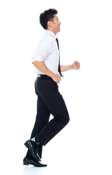 istock Handsome Asian Businessman - running 1160509219