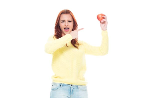 istock Female holding an apple 1160513351