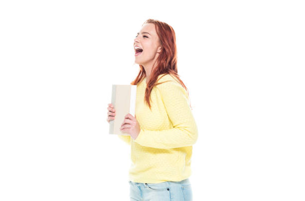istock Cute female holding one book 1160513475