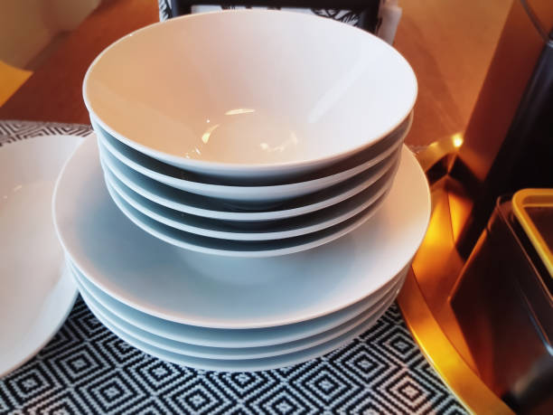 istock Close-up Set of Stacked White Bowls on Table 1160513538