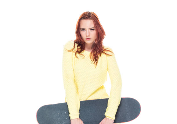 istock Cute female holding a skateboard 1160514633