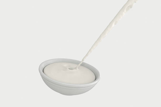 istock A bowl of milk and splashing liquid, 3d rendering. 1160517755