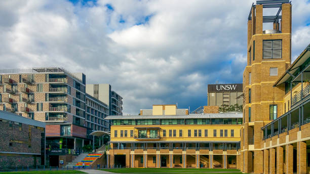 Dramatic white clouds and blue sky hovering over the Quadrangle Building stock photo