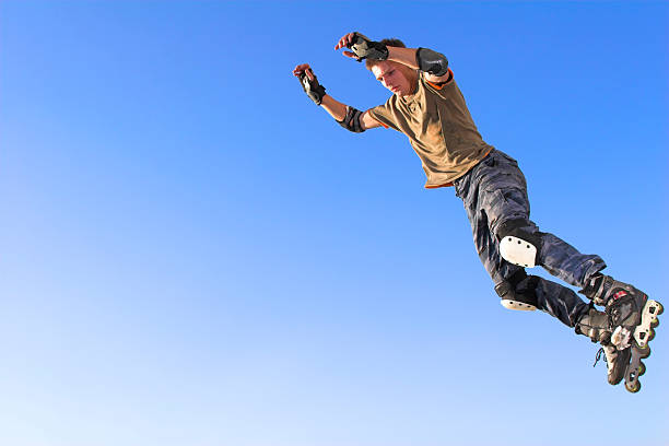 istock Active  roller boy  jumping from parapet on the blue sky 116052056