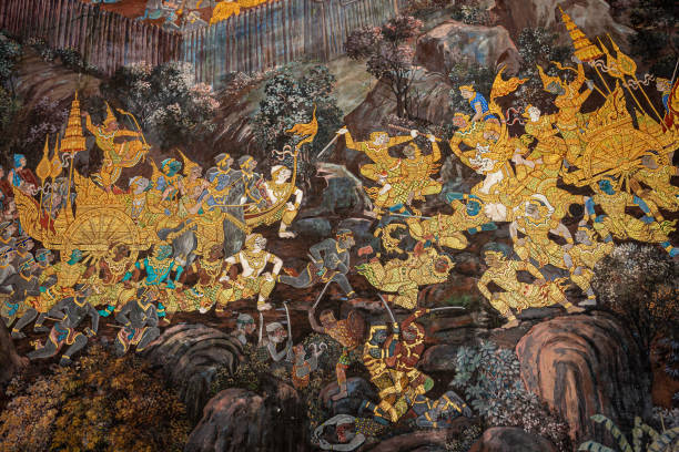 Gold color of old mural is the story of Ramakian,Generally in Thailand, any kinds of art decorated in Buddhist church, temple pavilion, temple hall, monk's house etc. created with money donated by people to hire artist. They are public domain or treasure Thailand, Wat Phra Kaeo, Asia, Bangkok, Grand Palace - Bangkok public domain photos stock pictures, royalty-free photos & images