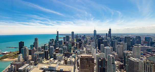 Chicago panorama. Cityscape aerial view, spring day. High rise buildings and lake Michiganl, blue sky background. High angle panoramic view from skydeck, banner