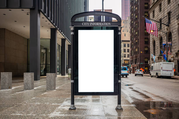 Blank billboard at bus stop for advertising, Chicago city buildings and street background Blank white ad billboard at bus stop for advertising, Chicago city buildings and street background. Copy space commercial sign photos stock pictures, royalty-free photos & images