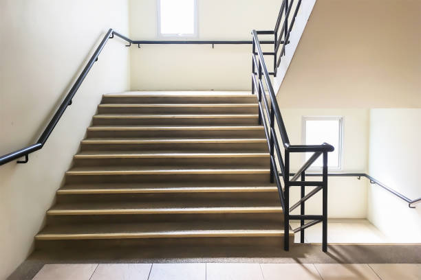 Beautiful and simple background image of  staircase for public. Interior architecture of public staircase with handrail made by steel pipe. Beautiful and simple background image of  staircase for public. Interior architecture of public staircase with handrail made by steel pipe. landing home interior stock pictures, royalty-free photos & images