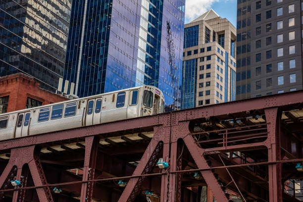 istock Chicago train on a bridge, skyscrapers background, low angle view 1160520870