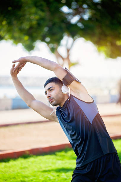 istock Young man exercising in a public park. 1160523935
