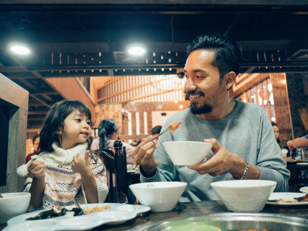 istock Hipster father and his daughter enjoying in Korea restaurant. 1160526921