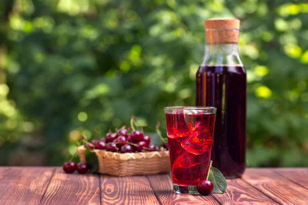istock cherry juice or cocktail with ice in glass 1160526982