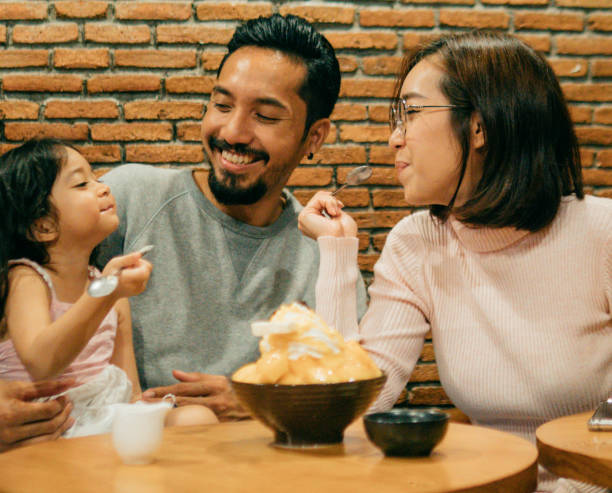 istock Asian family having dinner together with dessert. 1160527914